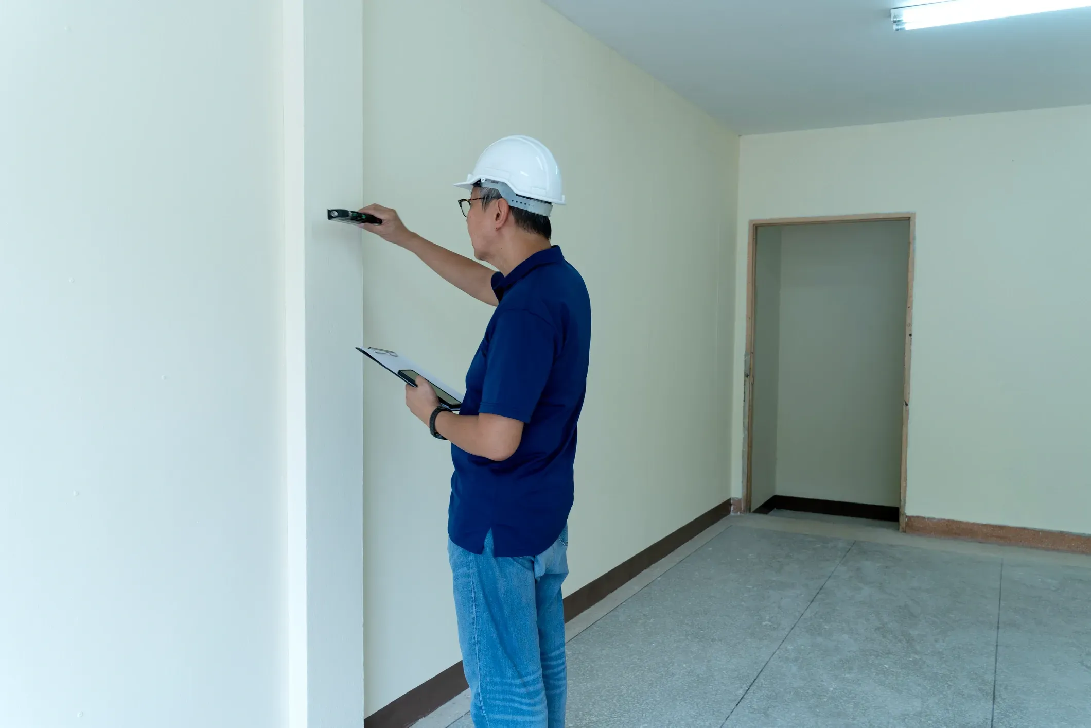 Professional checking a new-build interior